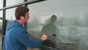 How to clean a window with a squeegee